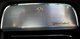 Thunderbird glove compartment door with ribbed chrome